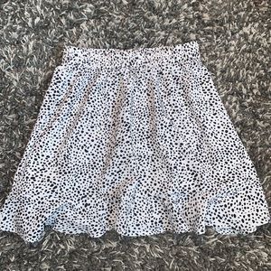This is a dalmatian print skirt with ruffle accent on the bottom.
